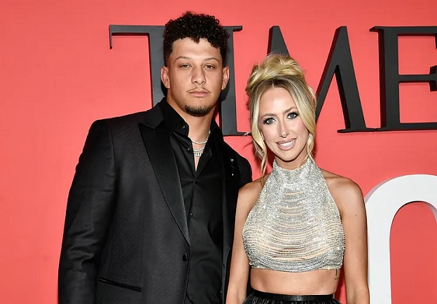 Patrick Mahomes places his hand lower than usual on Brittany's back during red carpet