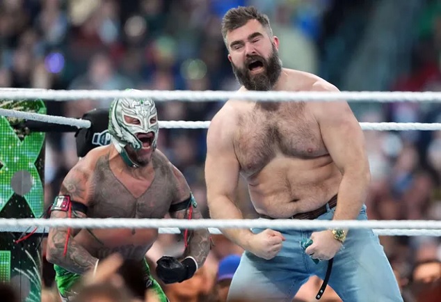 JUST IN: Jason Kelce and Lane Johnson make surprise appearance at WrestleMania at Philadelphia's Lincoln Financial Field - home of the Eagles - as they help Rey Mysterio and Andrade to victory