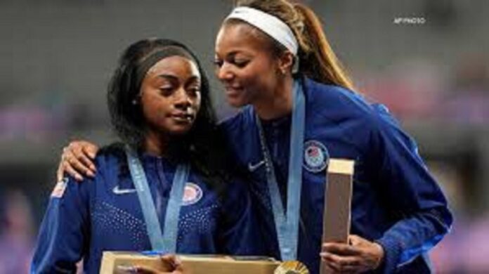 Atlanta’s Gabby Thomas embraces her teammate, Sha’Carri Richardson, as she gets emotional after they received their gold medals for the women’s 4×100-meter relay.